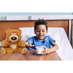 Child in hospital with Believe a Buddy 